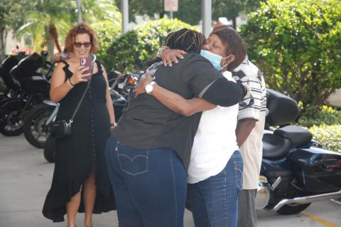 Shantell Williams hugs her mother, Sophia Harris, after her return following a motorcycle ride through 48 states. 