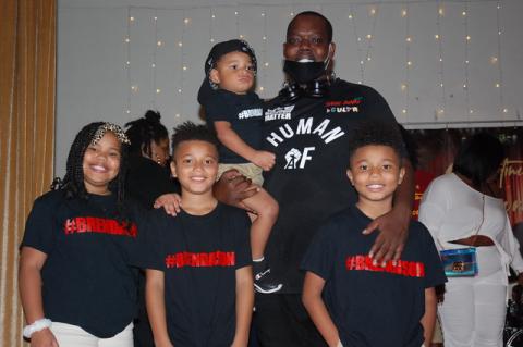 Comedian Kelvin poses with his family act after Thursday’s Showtime in Sanford.