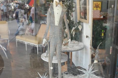 A dapper character in the window at Jeanine Taylor Folk Art Gallery.