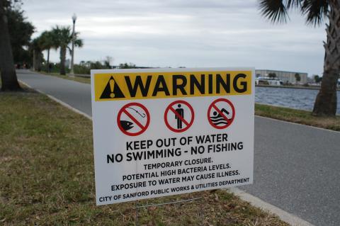 The City of Sanford Public Works & Utilities Department placed signs along Lake Monroe this week warning visitors of potential contamination in the water. 