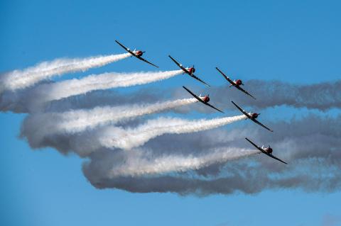 The six Geico Skytypers WWII era planes fy over the Lockheed Martin Space and Air Show this weekend. The show ran both Saturday and Sunday and brought many people to the Orlando-Sanford International Airport.
