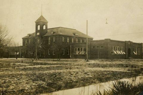 The former high school, shown here with the added wings when it served as the Sanford Grammar School.