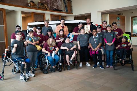 Participants in Kairos Adventures (above) pose in front of the new Land Rover Defender, which was outfitted for Kairos as part of the “Defender Service Awards” presented by CHASE.