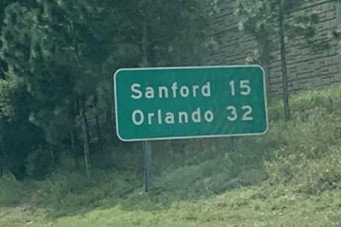 6. On I-4, between the CR 472 exit and the Saxon Boulevard exit, is a sign saying: Sanford 15 miles. The real distance to the downtown Sanford post office, using roundabout heaven, is just under 13 1/2 miles.