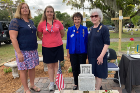 Teresa Johnson and Jennifer Eve (in pink shirt), both from the Central Florida Cemetery Project; Madelda Thompson, president of the local chapter of Daughters of 1812; and Kay McGee, historian for the Daughters of 1812 local chapter.