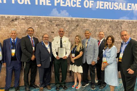 Volusia Sheriff Mike Chitwood (Center) with his award from Israeli community leaders.