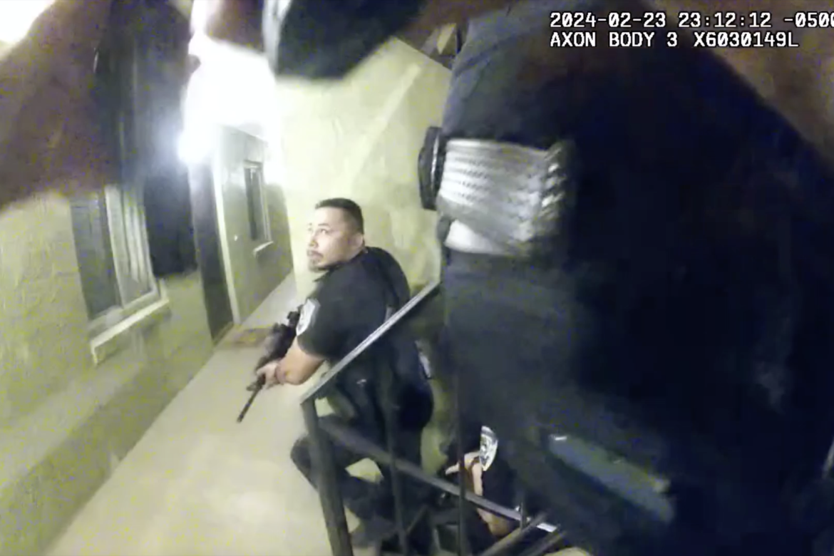One officer’s body camera (above) shows Altamonte Springs police as they approached the suspect’s front door. 